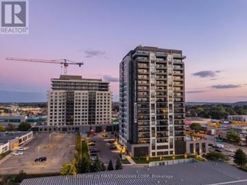 Kitchener house for rent - A real estate company logo is displayed on a building under construction.