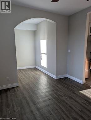 Brantford apartment for rent - A room with a wooden floor and a window letting in sunlight.