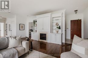 Toronto (The Beaches) condo for rent - A living room with a fireplace and a couch.