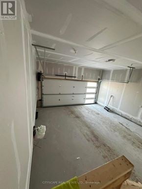 Barrie apartment for rent - A room under construction with exposed pipes and unfinished walls.