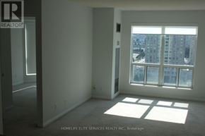 Toronto (Woburn) condo for rent - A room with a large window and a view of a cityscape.
