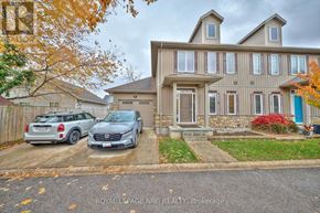 Niagara-On-The-Lake (Town) townhouse for rent - Two cars are parked in front of a house.