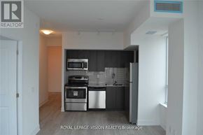 Pickering (Bay Ridges) condo for rent - A kitchen with stainless steel appliances and a dishwasher.