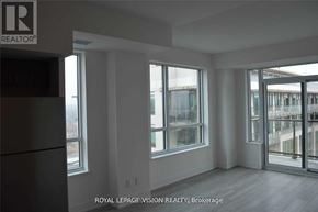 Pickering (Bay Ridges) condo for rent - A room with a large window and a door leading to a balcony.