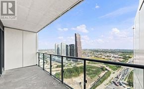Vaughan (Vaughan Corporate Centre) condo for rent - A balcony with a view of a cityscape and a highway.