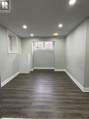 Milton (Fo Ford) apartment for rent - A room with wood flooring and white walls.