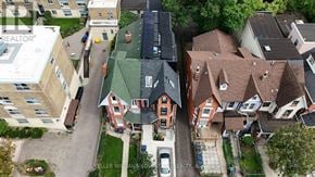 Toronto (Kensington-Chinatown) apartment for rent - A bird's eye view of a street with houses and a car.