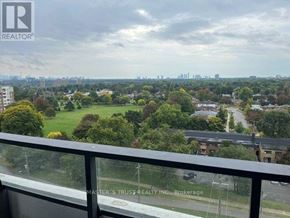 Toronto (Humber Heights) condo for rent - A view from a balcony overlooking a residential area with trees and buildings.