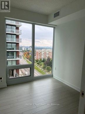 Toronto (Humber Heights) condo for rent - A realtor's office showing a balcony with a view of a city.