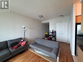 Toronto (Waterfront Communities) condo for rent - A living room with a grey couch and a grey sofa.