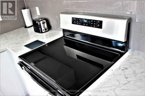 Hamilton (Hannon) townhouse for rent - A modern kitchen with a stainless steel oven and a toaster on the counter.