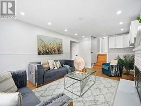 Brampton (Madoc) apartment for rent - A living room with a grey couch and a glass coffee table.