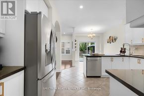 Milton (Be Beaty) apartment for rent - A modern kitchen with a refrigerator and a dishwasher.