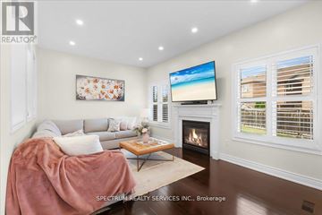 Milton (Be Beaty) apartment for rent - A living room with a fireplace and a television on the wall.