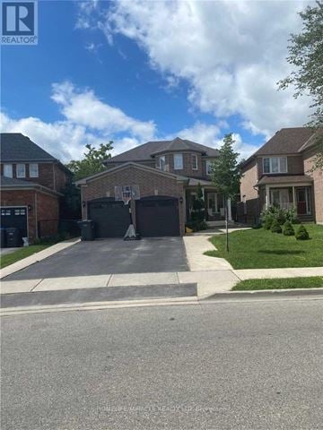 Brampton (Sandringham-Wellington) apartment for rent - A residential street with houses on both sides and a clear sky.