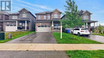 Southgate apartment for rent - A white car is parked in front of a house with a garage.