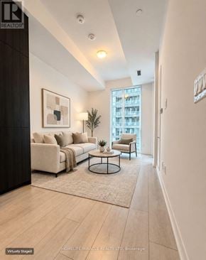 Toronto (Waterfront Communities) condo for rent - A living room with a couch, chair, and coffee table.