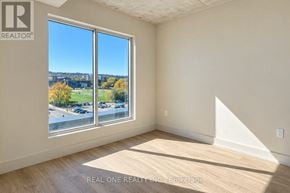 Mississauga (Meadowvale) apartment for rent - A room with a large window overlooking a parking lot.