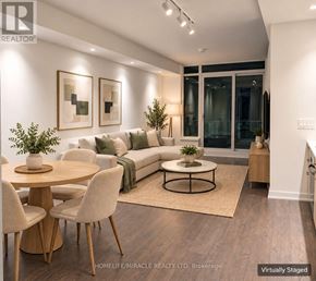 Toronto (High Park-Swansea) condo for rent - A spacious room with wooden flooring and white walls.
