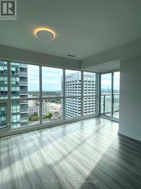 Toronto (Flemingdon Park) condo for rent - A spacious room with a view of the cityscape outside the large windows.