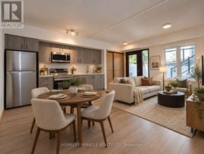Toronto (Tam O'shanter-Sullivan) condo for rent - A modern kitchen with a dining table set for two.