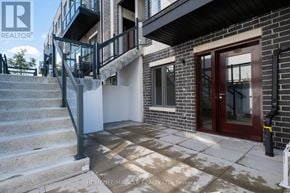 Toronto (Tam O'shanter-Sullivan) condo for rent - A house with a staircase leading to the second floor.
