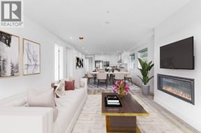 Gibsons apartment for rent - A modern living room with a fireplace and a television.