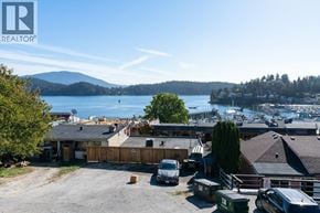 Gibsons apartment for rent - A realtor logo is on a picture of a house.