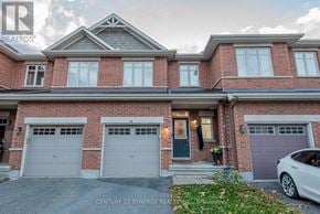 Ottawa townhouse for rent - A house with a grey car parked in front.