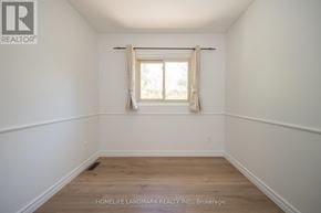 Oakville (Fd Ford) apartment for rent - A room with a window and wooden flooring.