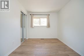 Oakville (Fd Ford) apartment for rent - A room with a window and wooden flooring.