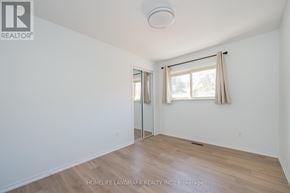 Oakville (Fd Ford) apartment for rent - A room with a sliding glass door and a window with curtains.