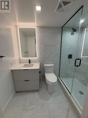 Toronto (North St. James Town) condo for rent - A white bathroom with a sink, toilet and shower.