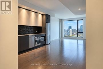 Ottawa condo for rent - A modern kitchen with a view of the city.