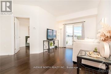 Ottawa condo for rent - A living room with a glass table and a couch.