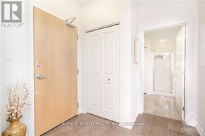 Ottawa condo for rent - A realtor photo of a white door in a hallway.