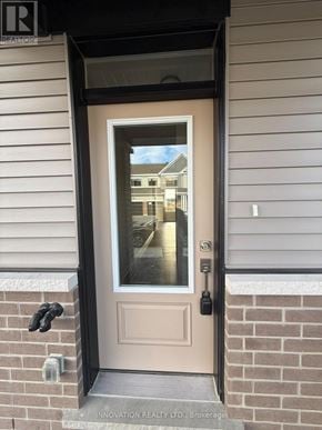 Ottawa townhouse for rent - A door with a glass window and a handle.