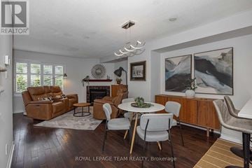 Ottawa apartment for rent - A living room with a fireplace and a painting on the wall.