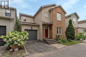 Ottawa apartment for rent - A house with a red door is for sale by Royal LePage Team Realty.