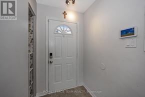 Ottawa apartment for rent - A white door with a cross above it in a room.