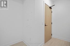 Toronto (Waterfront Communities) condo for rent - A room with a door and a white wall.