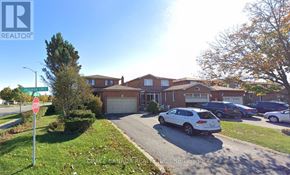 Vaughan (West Woodbridge) apartment for rent - A realtor photo of a residential area with houses and cars.