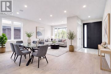 Toronto (Englemount-Lawrence) apartment for rent - A modern living room with a glass table and grey chairs.