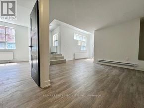 Toronto (Church-Yonge Corridor) condo for rent - A spacious room with wooden flooring and a large window.