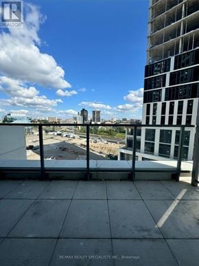 Waterloo condo for rent - A view from a balcony overlooking a construction site.