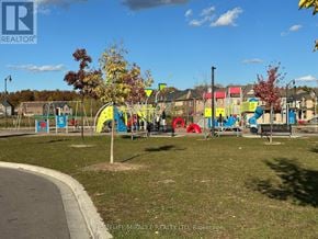 Brampton (Northwest Brampton) apartment for rent - A playground with a slide, swings, and other equipment.