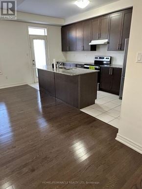 Brampton (Northwest Brampton) apartment for rent - A kitchen with dark wood floors and white walls.