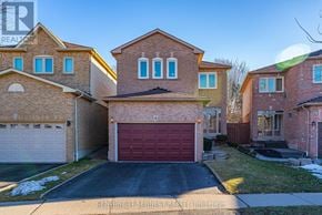 Whitby (Williamsburg) apartment for rent - A house with a red garage door is for sale.