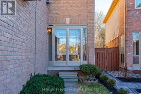 Whitby (Williamsburg) apartment for rent - A brick house with a glass door and a sign that says Century 21 Kennett Realty, Brokerage.