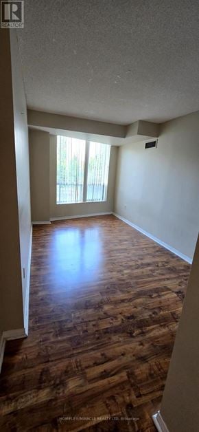 Toronto (Newtonbrook East) condo for rent - A room with wooden flooring and a window.